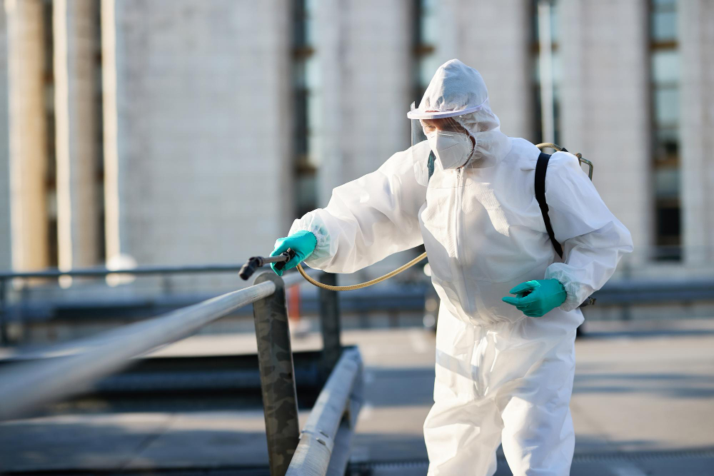 male cleaner protective suit disinfecting public area city due coronavirus epidemic
