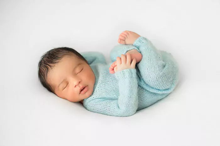 little infant newborn laying little white chair blue crocheted pijamas n 64d08e376de85