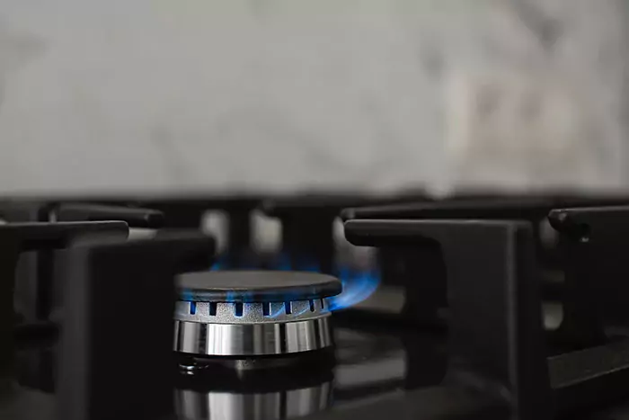 modern kitchen stove natural gas burns with blue flame household gas consumption close up selective focus n 650d797e9feff