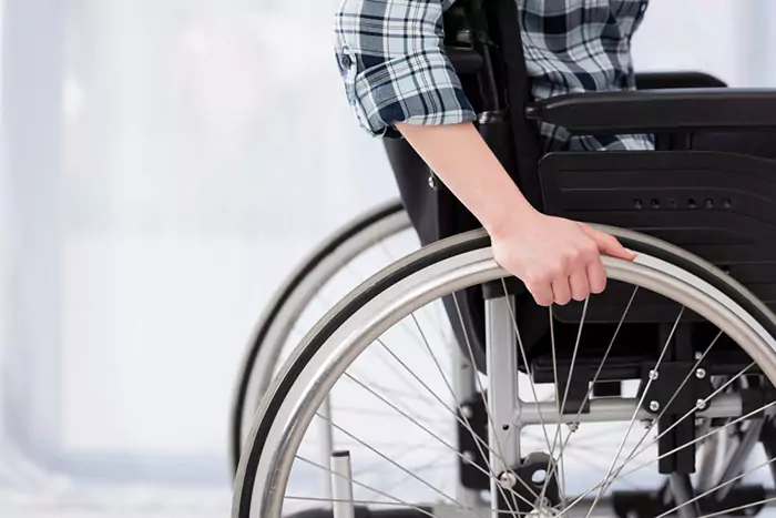 close up invalid person wheelchair n 6567964a2ec3a