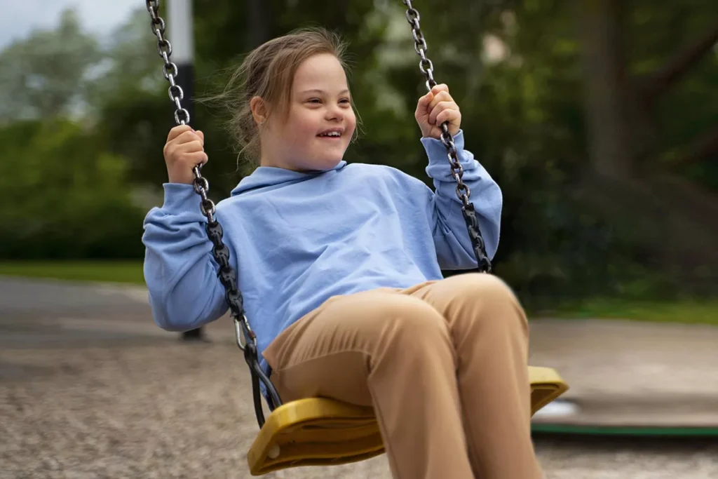 happy child with down syndrome playing1
