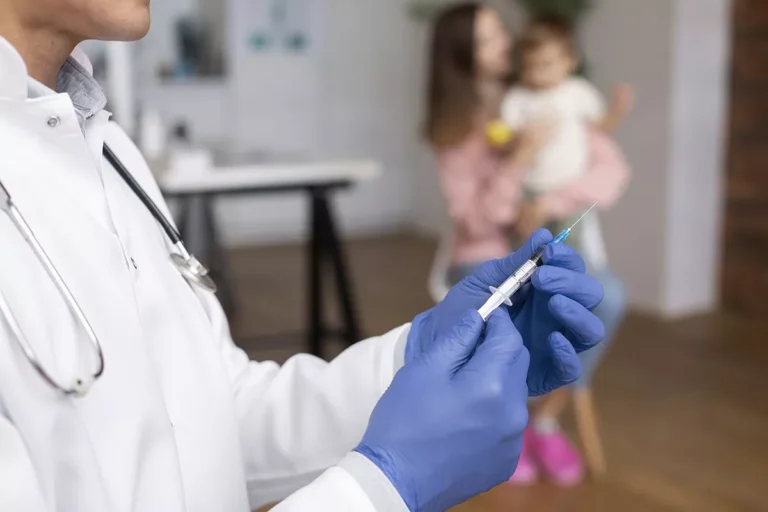male pediatrician administering vaccine his office 69ea35ffef08b